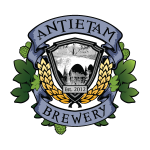 Antietam Brewery logo featuring a shield with a bridge illustration, wheat stalks, and green hops.